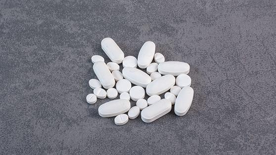 image assorted single-layer tablets on grey background