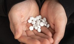 lot-white-tablets-hands-adult-man